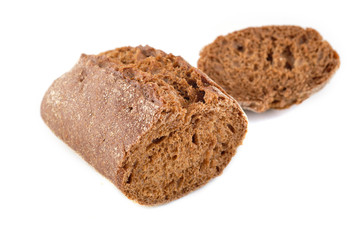 Black bread sliced on white background