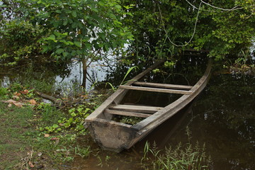 Wooden boat at the village Santa Clara near Puerto Narino at Amazonas river in Colombia