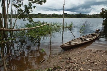 Fototapeta premium Wooden boat at the village Santa Clara near Puerto Narino at Amazonas river in Colombia