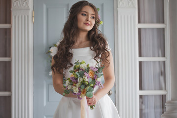Beautiful elegant bride in white dress. A charming young woman is getting married.