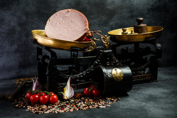 big chunk of appetizing boiled sausage on craft paper