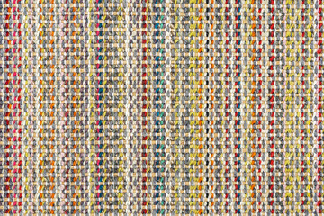 Multicolored knitted fabric background texture. Сolorful fabric with a pattern, Fragment colored wool carpet, bright wicker colorful rug