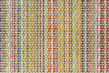 Multicolored knitted fabric background texture. Сolorful fabric with a pattern, Fragment colored wool carpet, bright wicker colorful rug