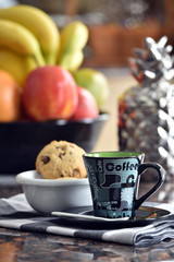 Cup of coffee and home made chocolate chip cookies