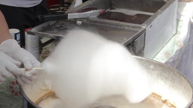 Cooking cotton candy in a special car outside
