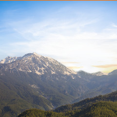 Obraz premium mountain valley in a snow at the sunset, natural background