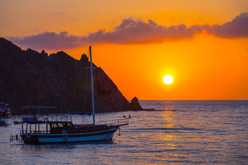quiet sea bay with yacht at the sunrise
