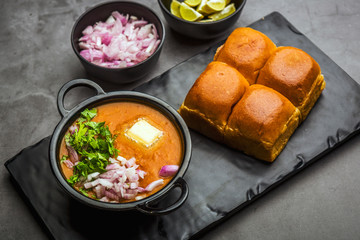Indian spicy fast food / snacks Pav Bhaji with bread, onion and butter
