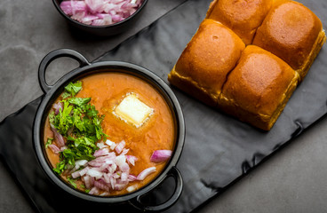 Indian spicy fast food / snacks Pav Bhaji with bread, onion and butter