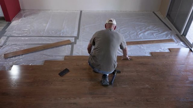 Time lapse of a homeowner installing a laminate floor