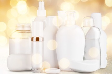 Cosmetic white bottles and spa products on a desk