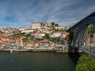 Fototapeta na wymiar Porto, Portugal old town ribeira aerial promenade view with colorful houses, Douro river and boats. May 2019