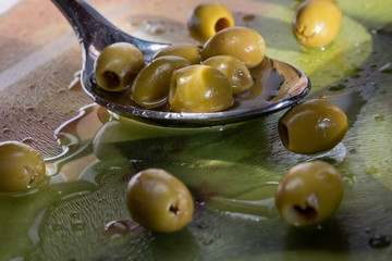 green olives in a glass bowl