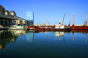 Fototapeta na wymiar Pier boats and yachts on the shore of the Caspian Sea in Baku.Baku port