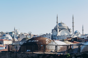 Naklejka premium The roof of the Grand Bazaar, Suleymaniye Mosque in Istanbul, Turkey. View of the mosque with minarets.