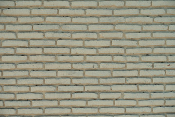 rough yellow brick wall. cracked texture