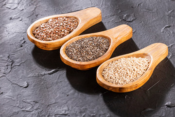 Quinoa, flaxseed and chia - Organic seeds. Superfoods. Text space