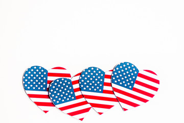American Independence day background with blue, white and red mixed stars and hearts. Celebration of American independence day, the 4th of July (the Fourth of July). Holiday concept. With copy space. 