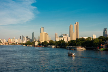 Fototapeta premium Beautiful cityscape views and ferry at the river in Bangkok thailand on April 24, 2019