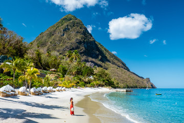 woman walking on the beach with dress, St Lucia, woman on the beach Saint Lucia - obrazy, fototapety, plakaty