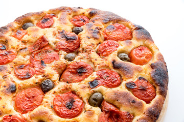 Focaccia typical of Bari Italy with tomatoes and olive