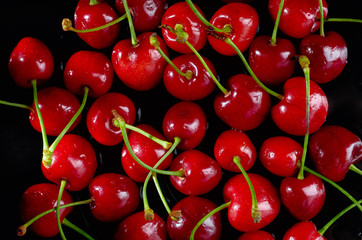 cherries on a black background, close up