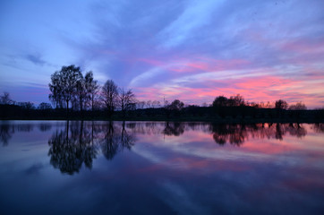 Fototapeta premium sunset on the lake reflection in water pacification slackness camping relaxation relaxationess