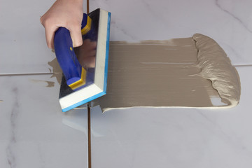 Process of grouting a floor