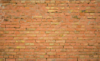 Old brick wall with wide seams