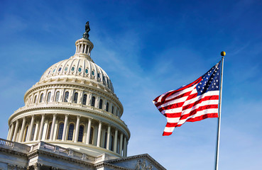 American flag waving with the Capitol Hill