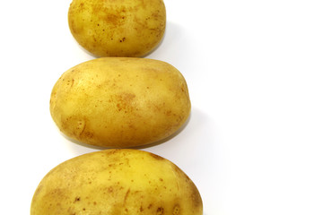 Potatoes in a peel on a white background