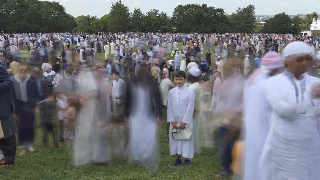 Time lapse. Muslims gathering for a festive prayer.
