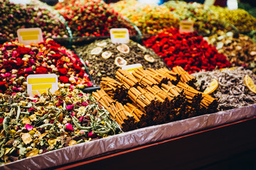 A variety of culinary seasonings in the eastern market. Bright and colorful tea shelves from the...