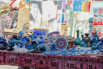 Trading table with souvenirs and paintings for tourists.