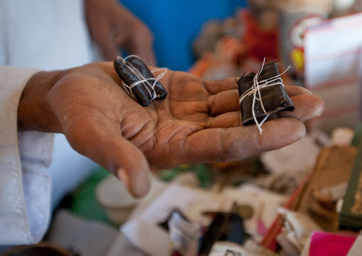 Little magic artefacts in the hand of witch doctor, Lamu, Kenya