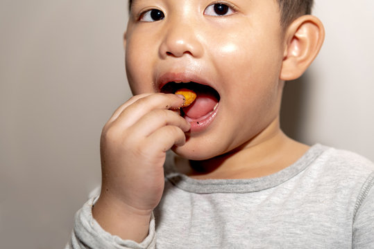 Portrait images of The boys eating snacks Deliciously, to food concept.