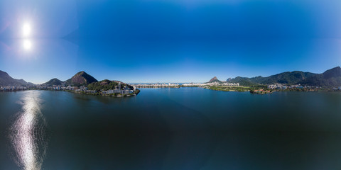 Aerial 360 degree panorama of the Rio de Janeiro city lake Lagoa Rodrigo de Freitas with intense...