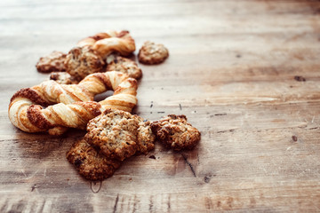 Cookies on a rustic wooden table. Homemade cookies with nuts and dried fruit. Top view flat lay background. Space for text. cookies on wooden table background