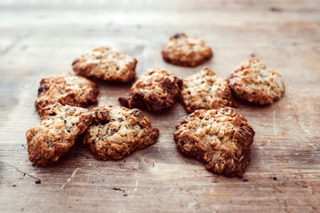 Cookies on a rustic wooden table. Homemade cookies with nuts and dried fruit. Top view flat lay background. Space for text. cookies on wooden table background