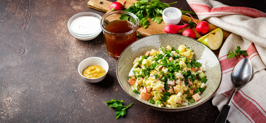 Cold Soup Okroshka with sausage, vegetables and kvass