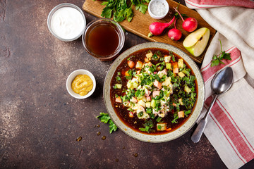Cold Soup Okroshka with sausage, vegetables and kvass