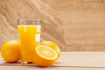 Orange juice and slices of orange on background