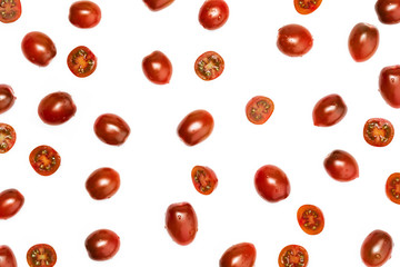 Texture of cherry tomatoes (mini kumakos) cut in half and whole. Isolated on white background.