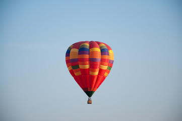 Big balloon. Balloon. Colorful bowl with basket. In the sky soars in the summer	