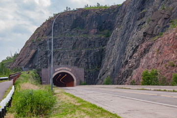 Silver Creek Cliff Tunnel on Highway 61 north of Two Harbors, Minnesota along the shore of Lake Superior was built as a safer alternative to the old road now part of the Gitchi-Gami State Trail © Rosemarie Mosteller