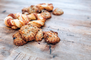 Cookies on a rustic wooden table. Homemade cookies with nuts and dried fruit. Top view flat lay background. Space for text. cookies on wooden table background