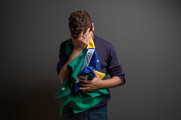 Men with brazilian flag and depression