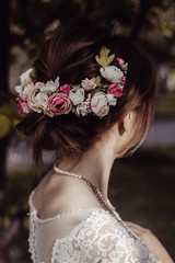 bride with hairstyle, flowers in her hair