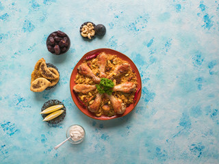 Homemade chicken Biryani on a blue background. 