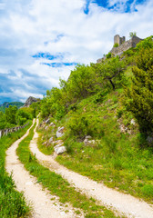 Obraz premium Cicolano (Italy) - The green mountain area of Salto Lake, Lazio region province of Rieti, with the ruins of medieval castle named Poggio Poponesco